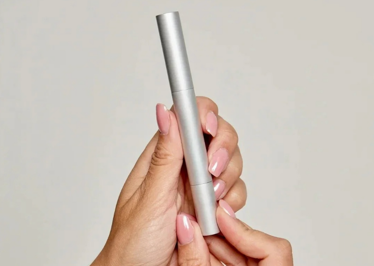 Teeth Whitening Powder on a white table with shadows