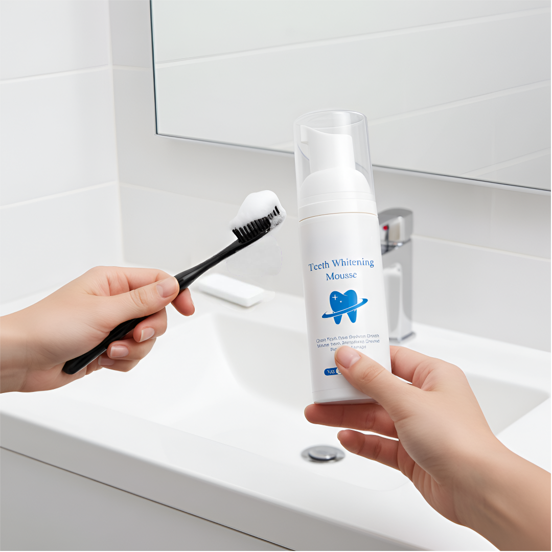 Person holding a toothbrush with foam and a bottle of teeth whitening foam in a bathroom setting.