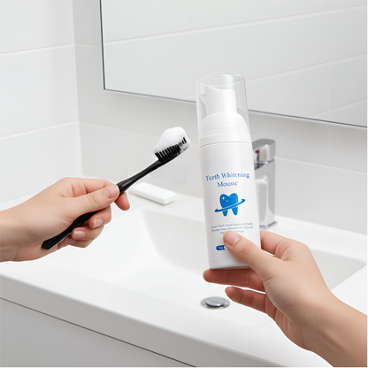 Person holding a toothbrush with foam and a bottle of teeth whitening foam in a bathroom setting.